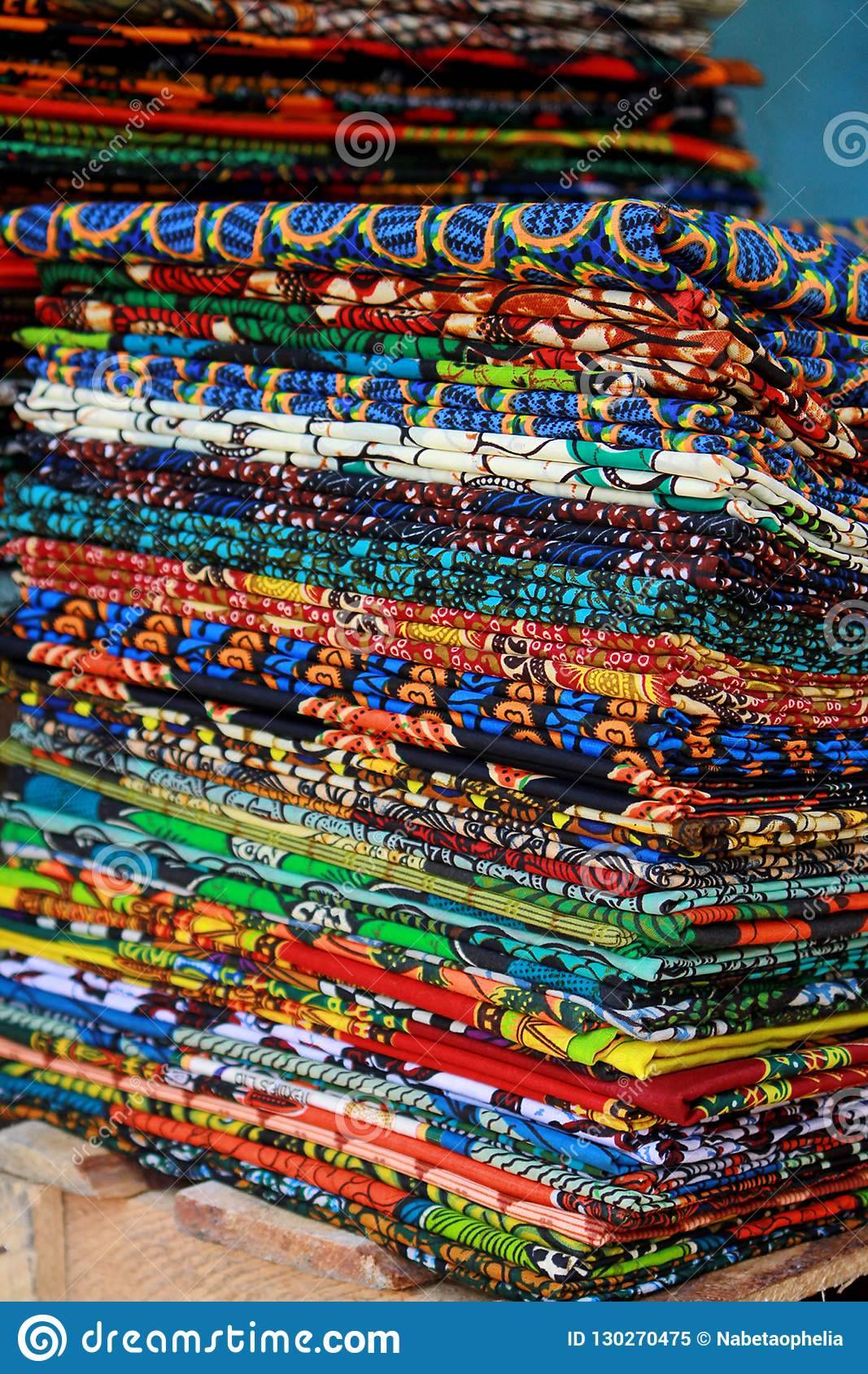 58569kitenge-fabric-makeshift-stall-along-street-accra-ghana-bright-vivid-colors-red-green-yellow-blue-orange-purple-130270475.jpg